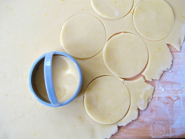 Cutting out dough circles.