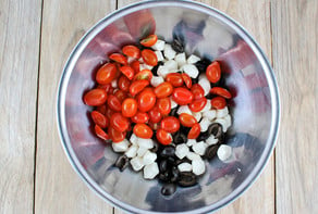 Caprese ingredients in a large bowl.