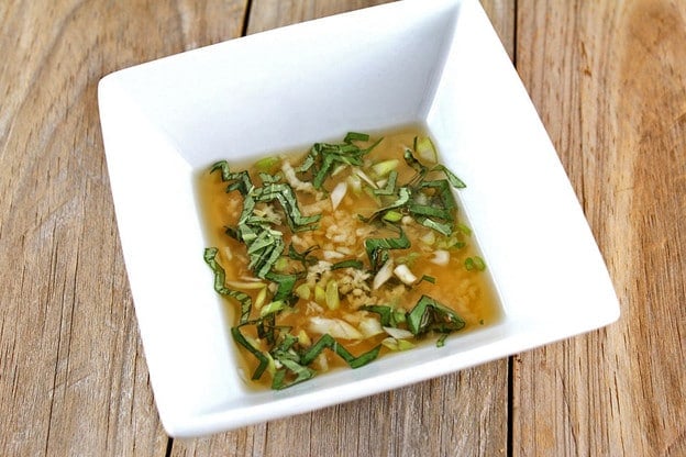Caprese dressing in a small bowl.