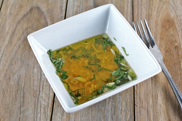 Caprese dressing in a small bowl.