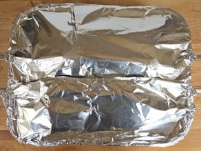 Roasting pan covered with foil.