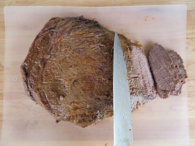 Slicing brisket against the grain.
