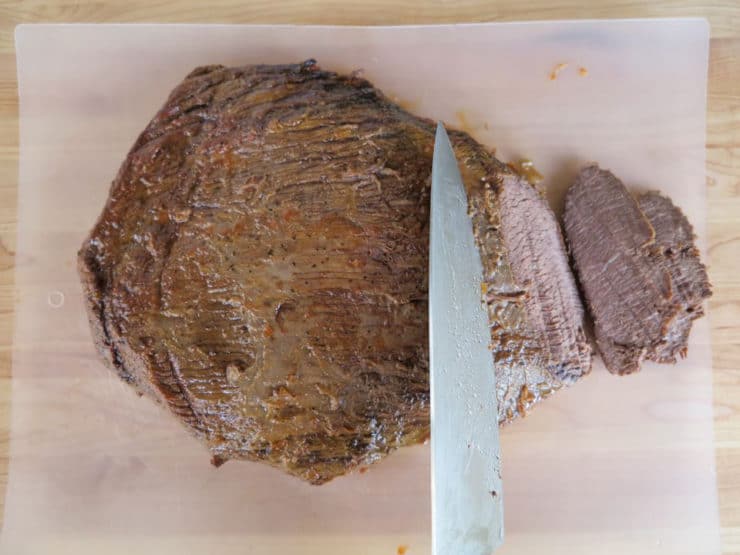 Slicing brisket against the grain.