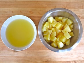Drain and reserve juice from canned pineapple.