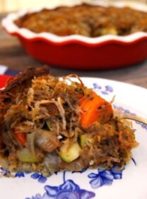 A savory potato pie with roasted vegetables, topped with a crispy potato crust