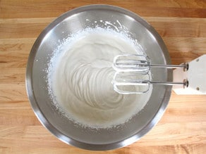 Whipping cream with a hand mixer.