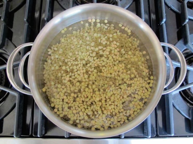 Lentils cooking in a pot.