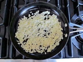 Diced onions in a skillet.