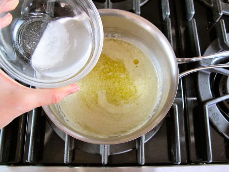 Stirring baking soda into melted butter.