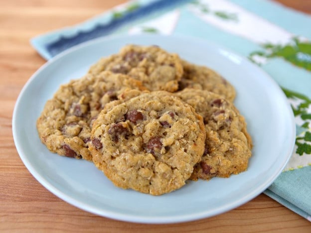 Coco Cookies served on a white plate with a blue colored table clothe on the side