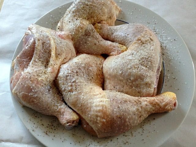 Chicken seasoned with salt and pepper.