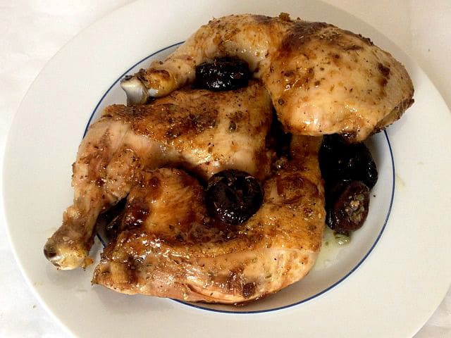 Chicken and prune in a serving dish.