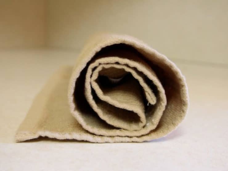 Rolling cake up in towel like a jelly roll.
