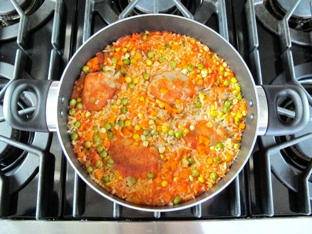 Arroz con Pollo in a skillet.