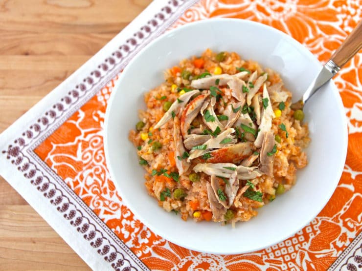 Mexican Arroz con Pollo- tomato vegetable rice, garlic and onion slow cooked with tender chicken. Easy healthy affordable one pot meal