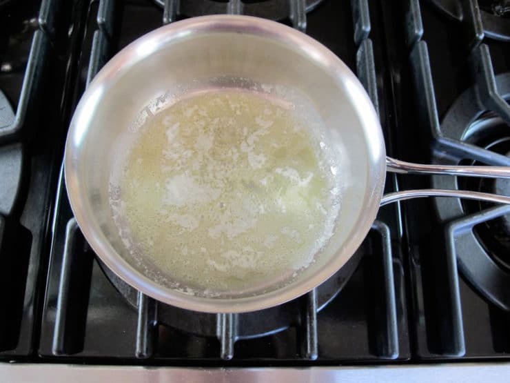 Making a roux in a saucepan.