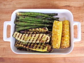 Grilled vegetables resting in a dish.