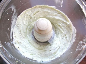 Blending cream cheese and seasoning in a food processor.