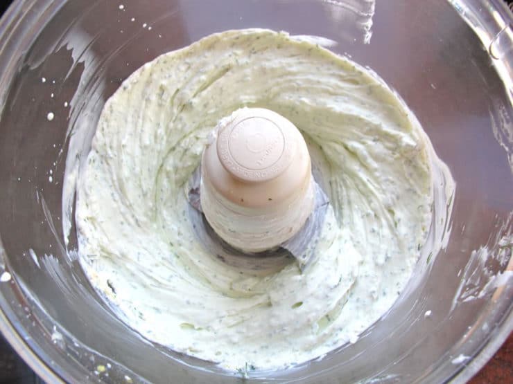 Blending cream cheese and seasoning in a food processor.