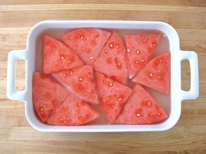 Watermelon wedges in a baking dish.