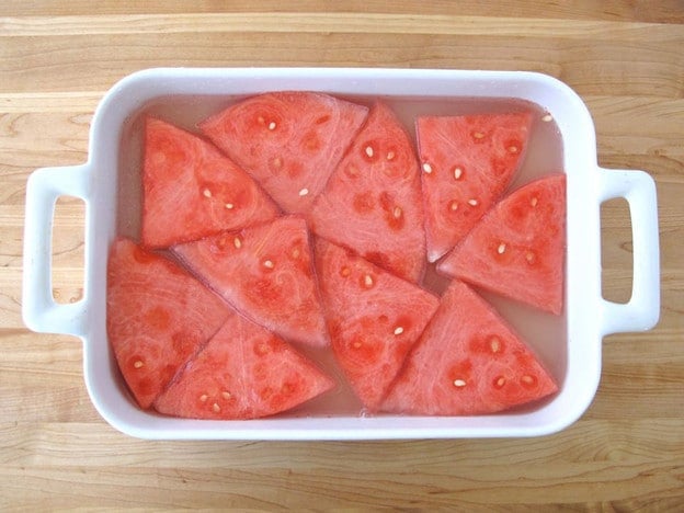 Watermelon wedges in a baking dish.