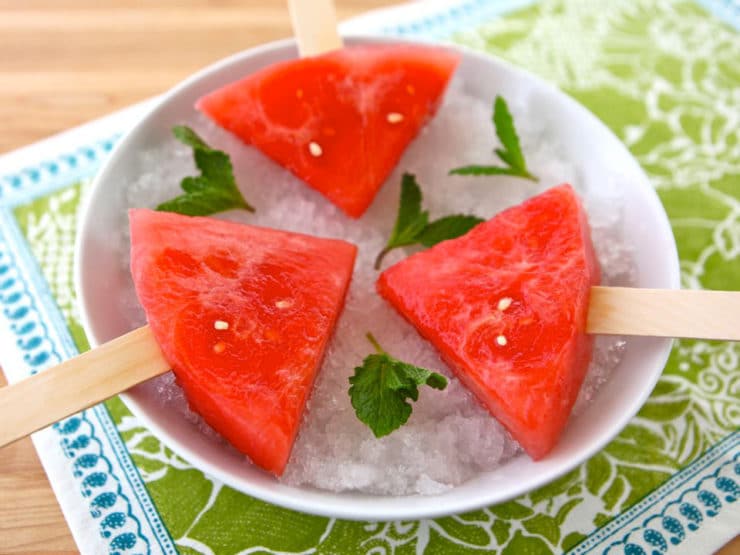 Watermelon Mojito Pops - slices of watermelon soaked in a mojito cocktail mixture, then frozen. A simple grown up boozy summer popsicle!