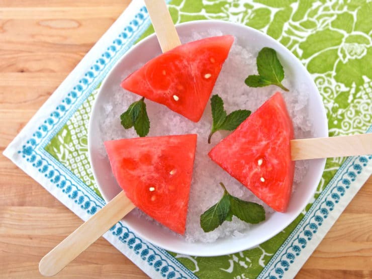 Watermelon Mojito Pops - slices of watermelon soaked in a mojito cocktail mixture, then frozen. A simple grown up boozy summer popsicle!