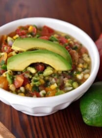 Mexican corn and avocado soup topped with Heirloom Tomato Salsa Fresca