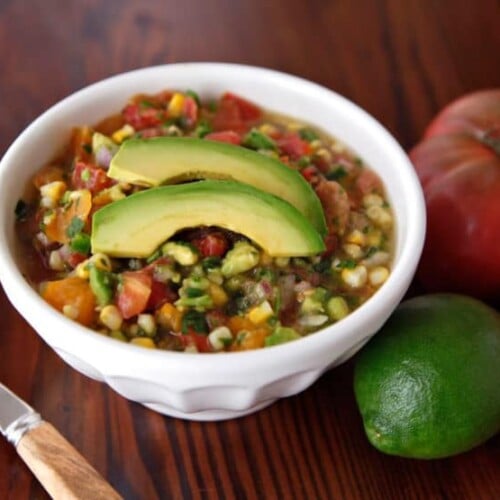 Mexican corn and avocado soup topped with Heirloom Tomato Salsa Fresca