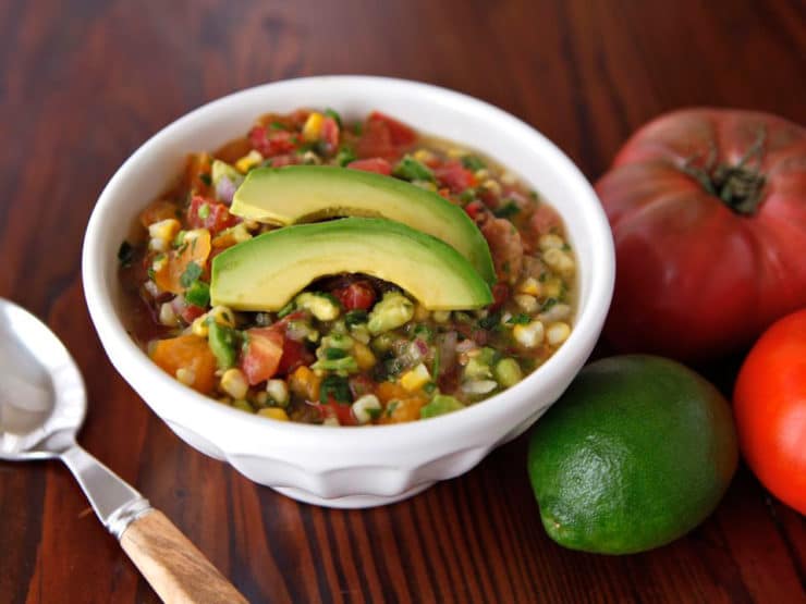 Mexican corn and avocado soup topped with Heirloom Tomato Salsa Fresca