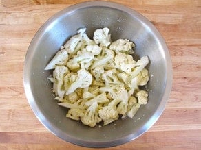 Cauliflower florets in a large bowl.