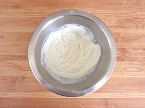 Ricotta and milk in a small bowl.