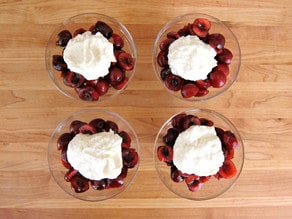 Cherries and cheese in 4 small dishes.
