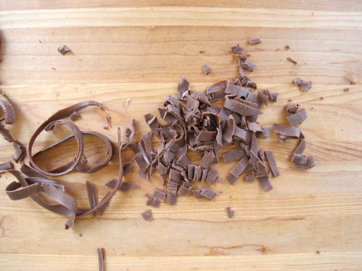 Chopping chocolate bar into pieces.