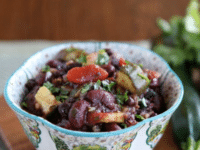 A delicious vegan chili made with black beans, zucchini, and tomatoes