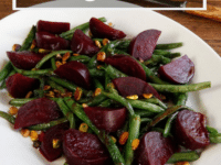 Green Bean Beet and Pistachio Salad on a white plate