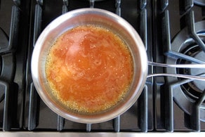 Quinoa cooking in tomato juice.
