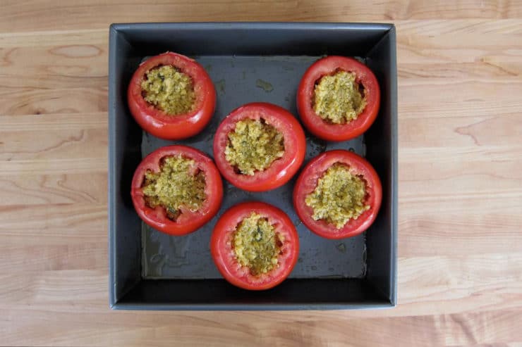 Cored tomatoes stuffed with quinoa.