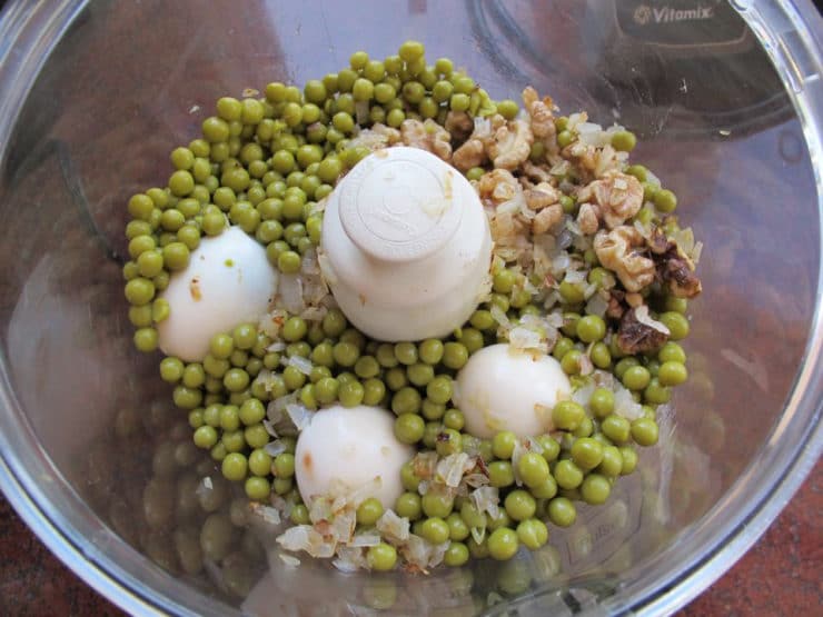 Peas and hard boiled eggs in a food processor.