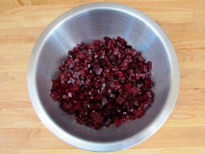Diced red beets in a mixing bowl.