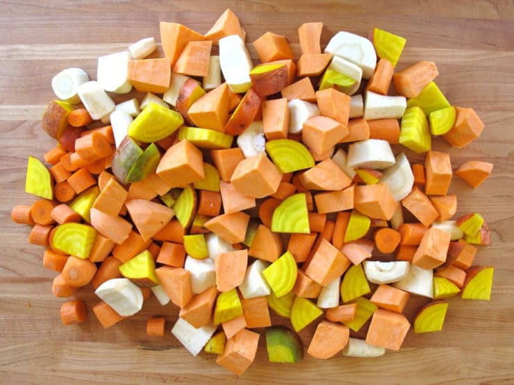 Diced root vegetables on a cutting board.
