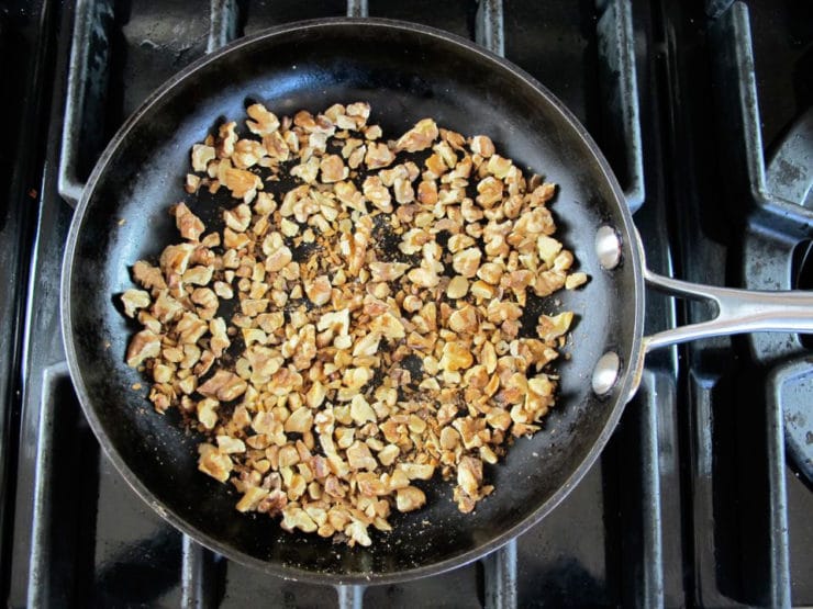 Dry toasting nuts in a skillet.