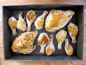 Browned chicken parts in a baking dish.