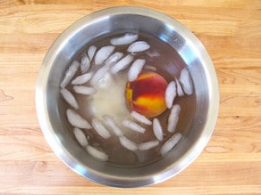 Peach in ice water to peel.