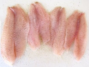 Rinsed fish fillets on paper towel.