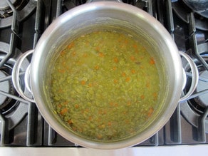 Cooking split peas in a stockpot.