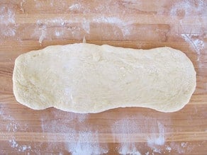 Section of challah dough rolled out.
