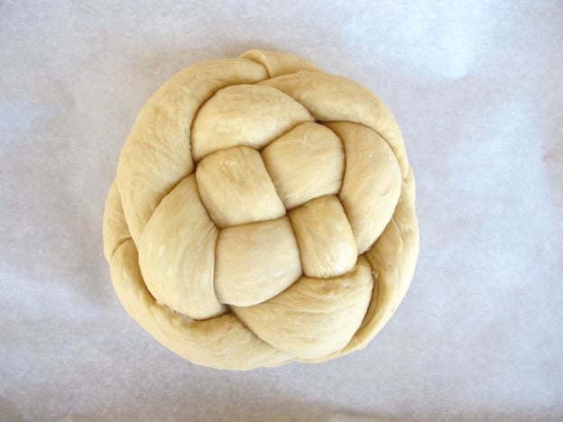 Challah loaf on parchment.