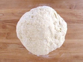 Challah dough on a floured surface.