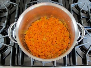 Carrots added to stockpot.